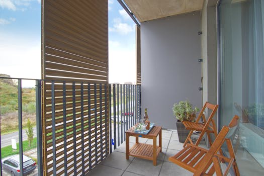 Apartment balcony with stylish privacy screen idea