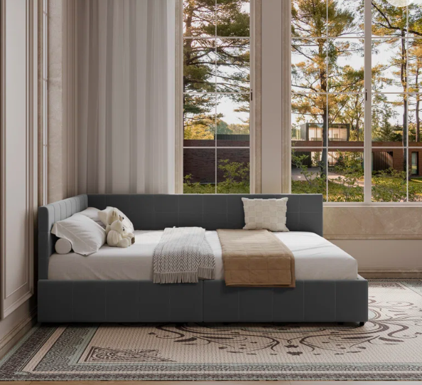 Small daybed styled as a cozy reading nook