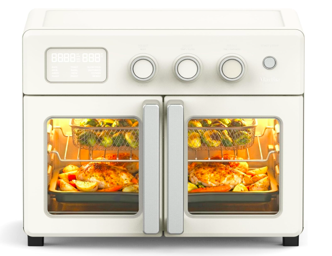 Martha Stewart French door air fryer oven in linen white with food cooking inside