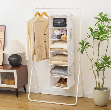 Hanging fabric closet organizer with folded clothes and accessories