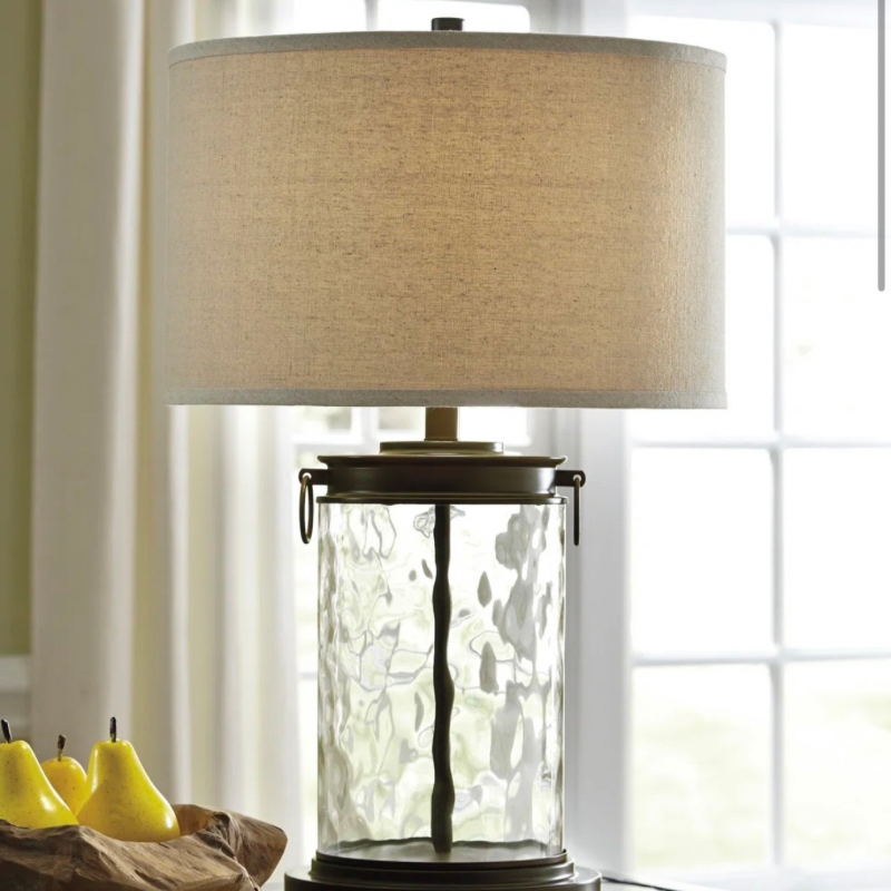 Textured glass table lamp with a neutral linen shade