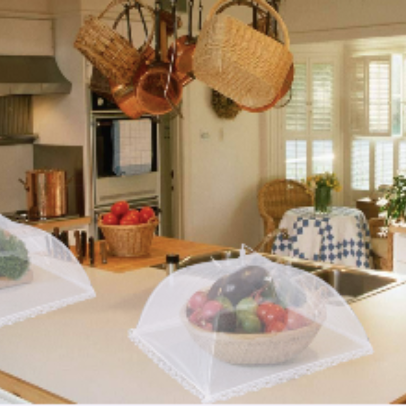 Mesh food tent covering dishes on a patio table