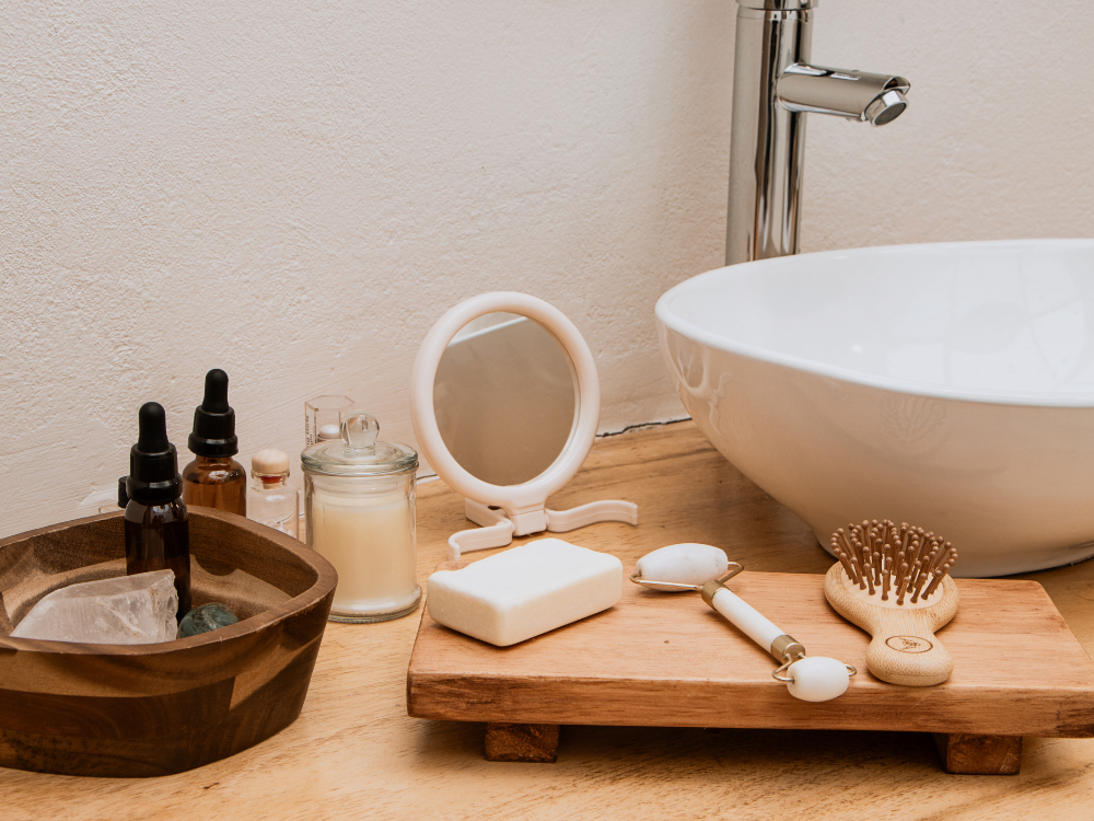 Bathroom countertop tray with soap dispenser and small decor.