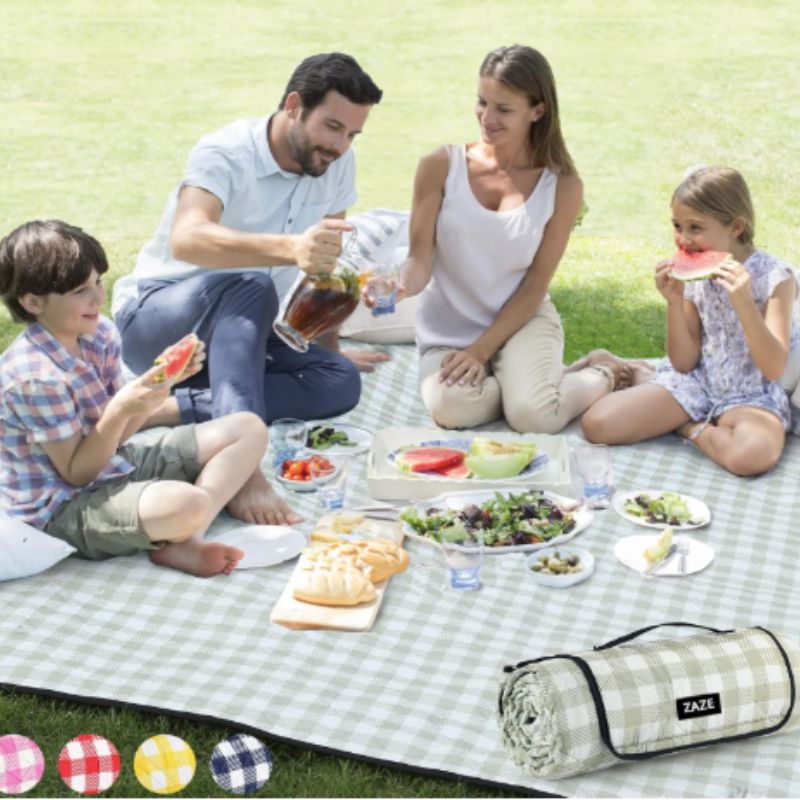 Foldable outdoor blanket arranged for a summer picnic