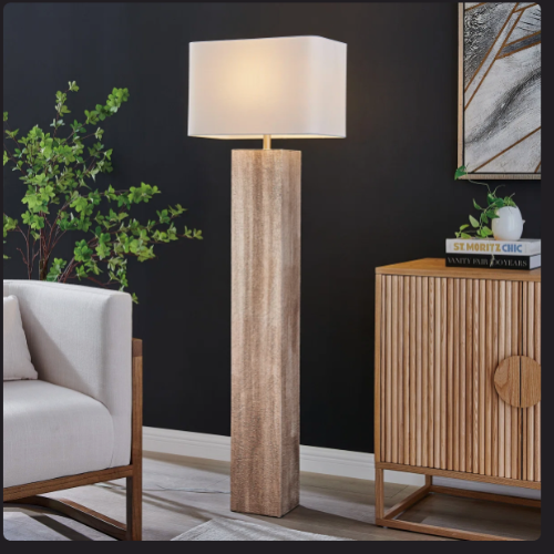 Tall wood floor lamp beside compact apartment furniture